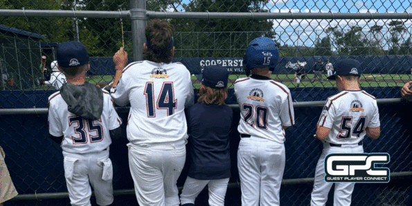 players looking through a fence at CASV